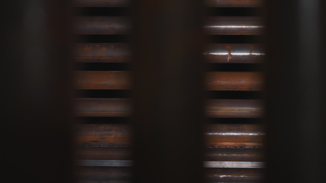 Iron pipes with rust stored in production factory warehouse