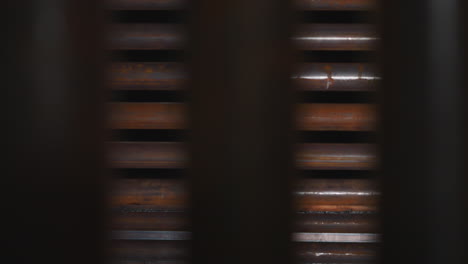 iron pipes with rust stored in production factory warehouse