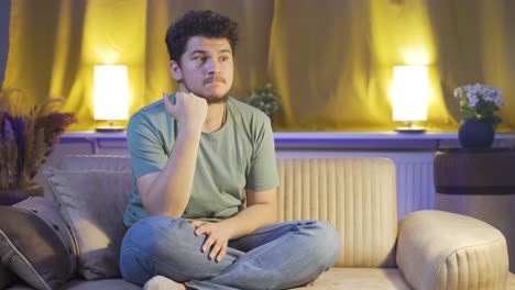 Man-biting-his-nails-because-of-stress-at-home-at-night.