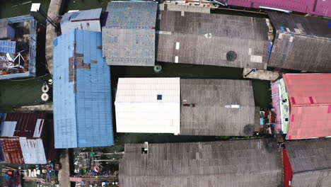 Rooftops-of-houses-of-Koh-Panyee-floating-village-with-boats-and-jetty