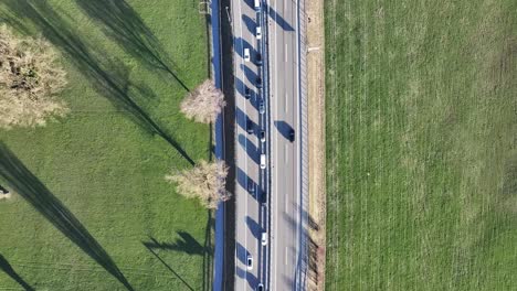 Shadow-Play-of-cars-cruising-on-Weesen-Autobahn,-Switzerland