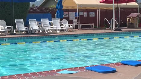 An-outdoor-lap-pool-with-water-rippling-in-the-sunlight