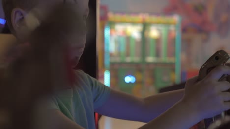 a boy in a painted face playing on a game machine