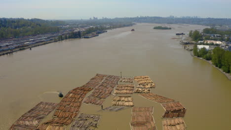 Aerial-view-of-log-booms-floating-in-the-Fraser-River-in-Vancouver,-British-Columbia