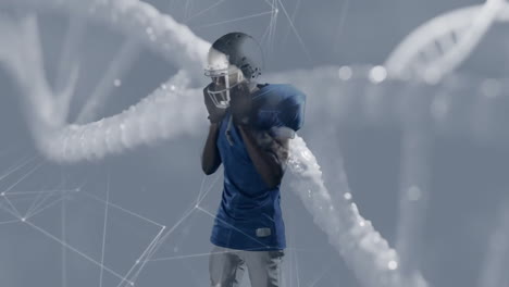 football player in blue jersey over dna strand and network connections animation