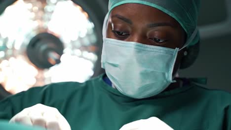 focused surgical professional engaged in a delicate procedure under intense lighting, demonstrating expertise and precision in a medical environment
