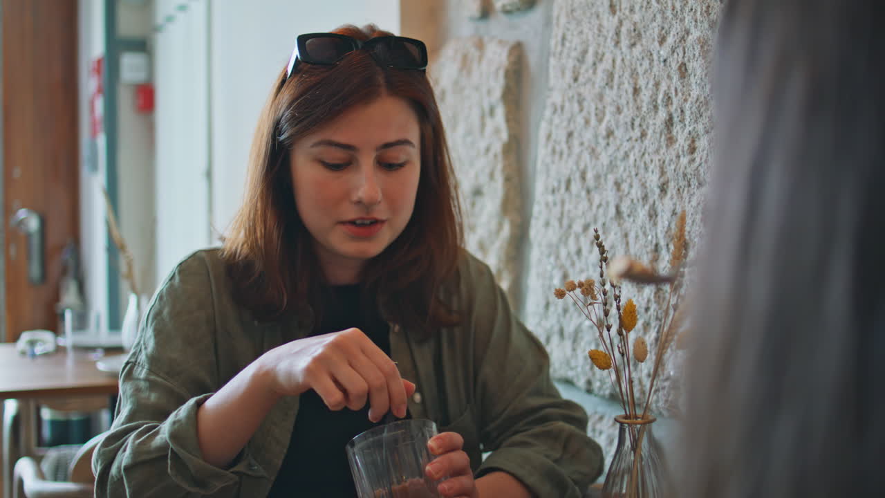 Woman having a conversation in a cafe
