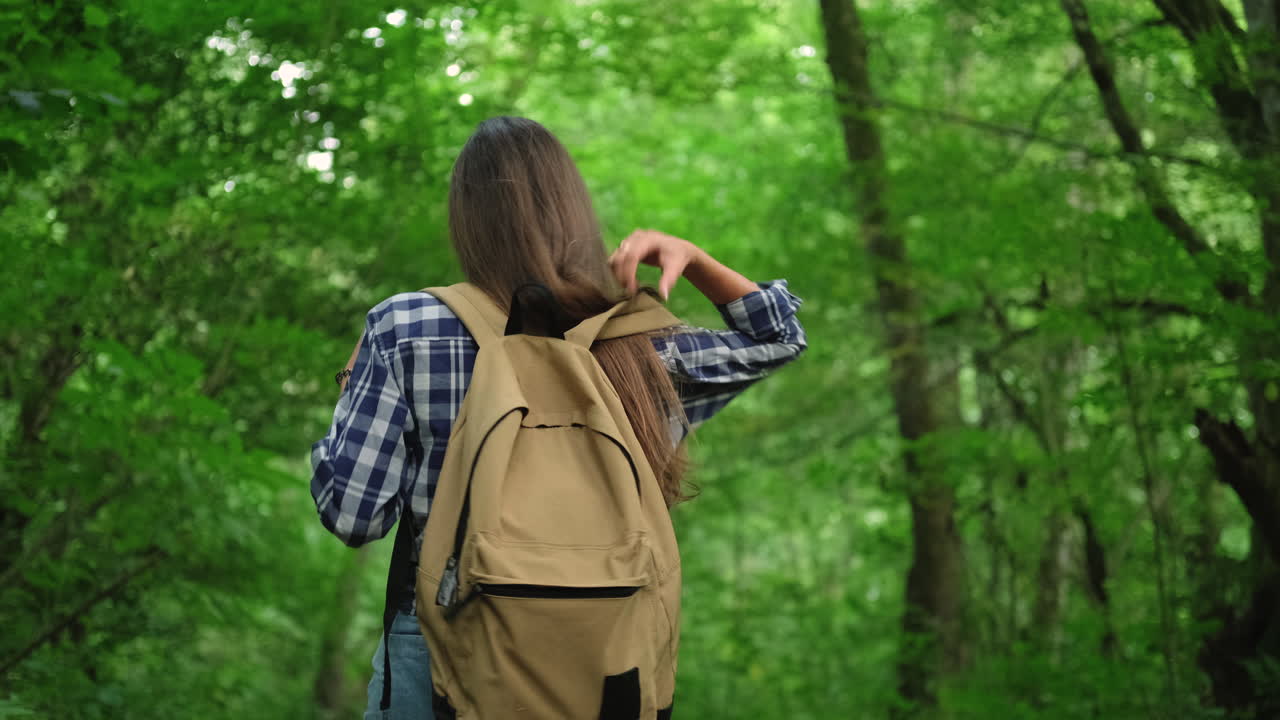 Woman Hiking in a Forest