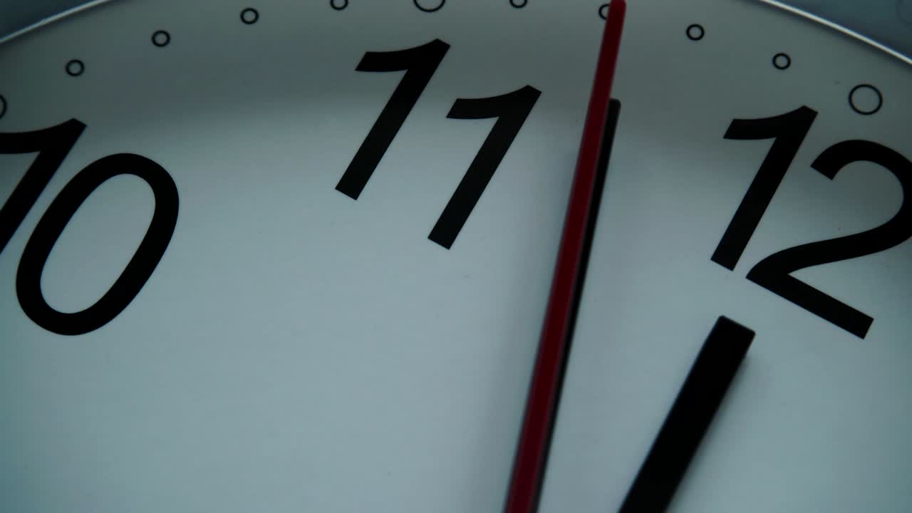 White clock hanging on wall ticking, full HD