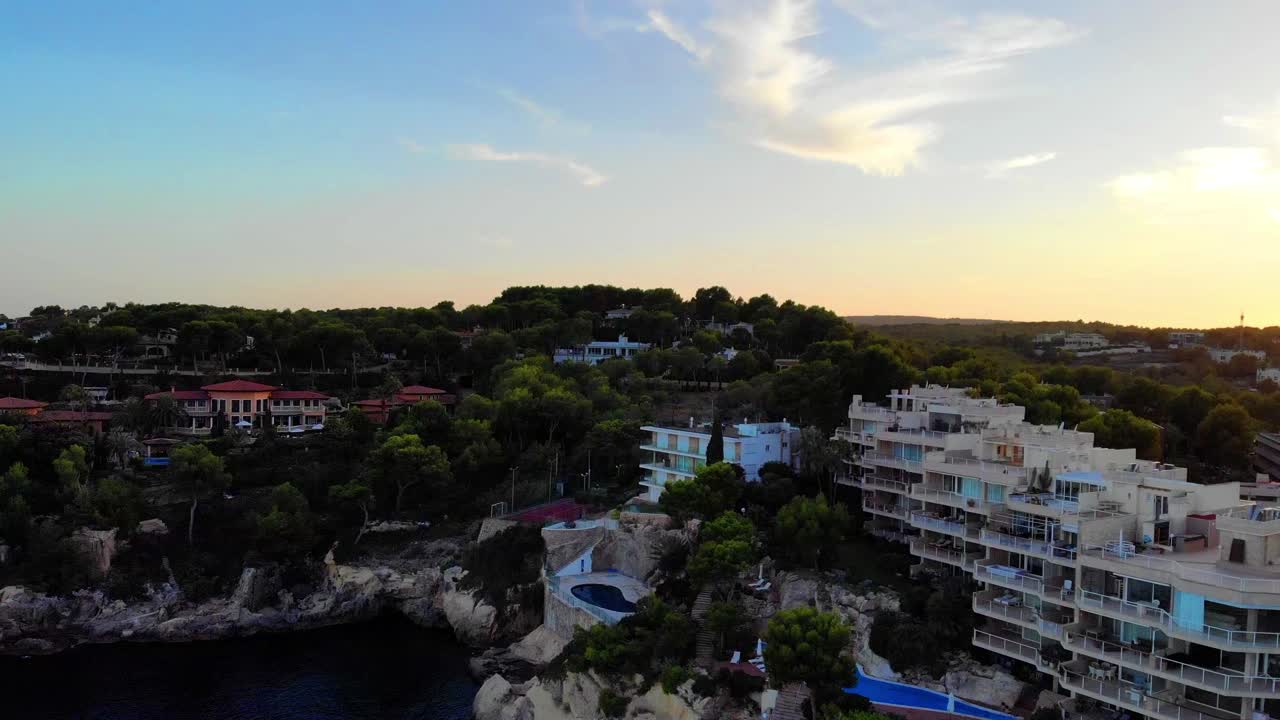 Aerial view of a beautiful hidden beach during sunset near Magaluf, Mallorca.
