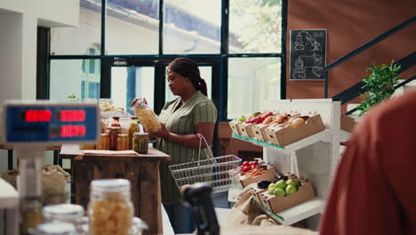 African-american-client-opening-jars-filled-with-bulk-items