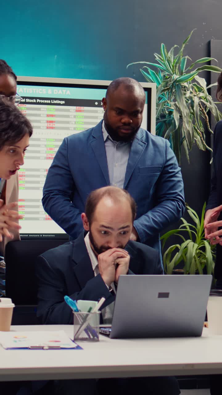 Colleagues Celebrate Success and Discuss Financial Strategy in Office