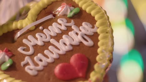 German-cute-Gingerbread-heart-with-flashing-bokeh-in-background