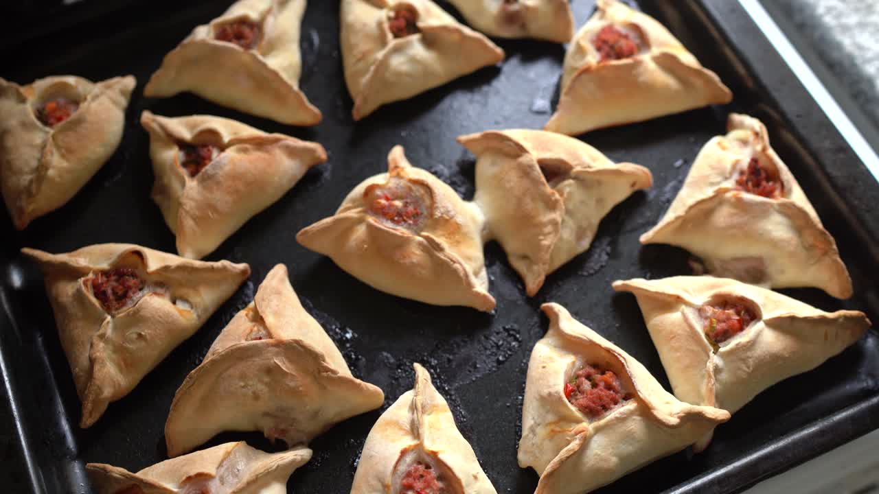 Freshly baked Middle Eastern savory hand pies. Delicious fatayers ready to eat