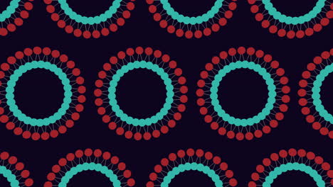 Symmetrical-circular-pattern-of-red-and-blue-dots-on-black-background