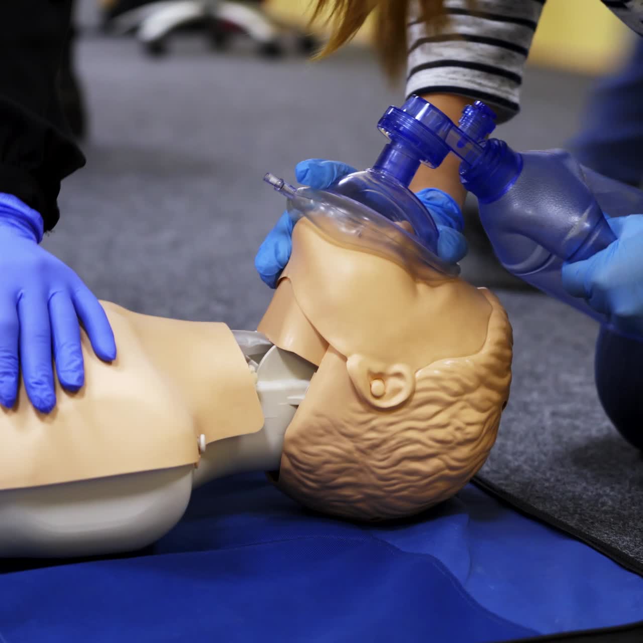 Medical male dummy on blue hospital blanket. Medical equipments for education. Training video for medics