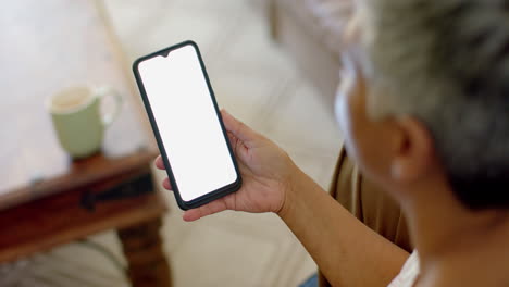 Senior-biracial-woman-using-smartphone-with-copy-space-at-home,-slow-motion