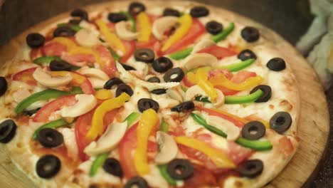 close up of showing delicious pizza rotating by hand