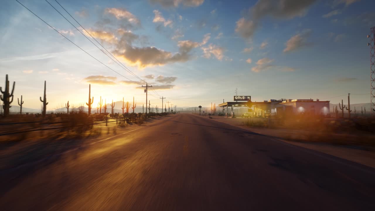 un dron vuela directamente sobre una carretera larga y vacía en el medio del desierto a la próxima gasolinera