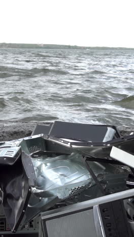 electronics waste dumped in a lake