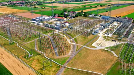 Aerial-View-Of-A-High-Voltage-Substation-In-Summer---drone-shot