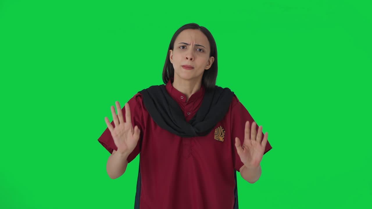 Angry Indian female hotel staff shouting on guests Green screen