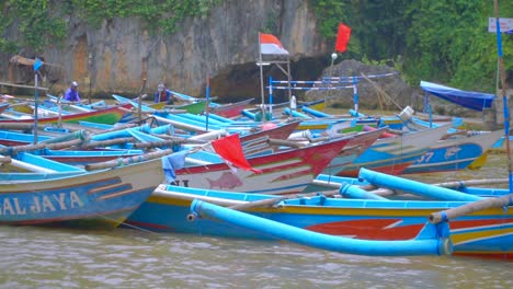 traditional fisherman boats anchored on the harbor - indonesia traditional fisherman