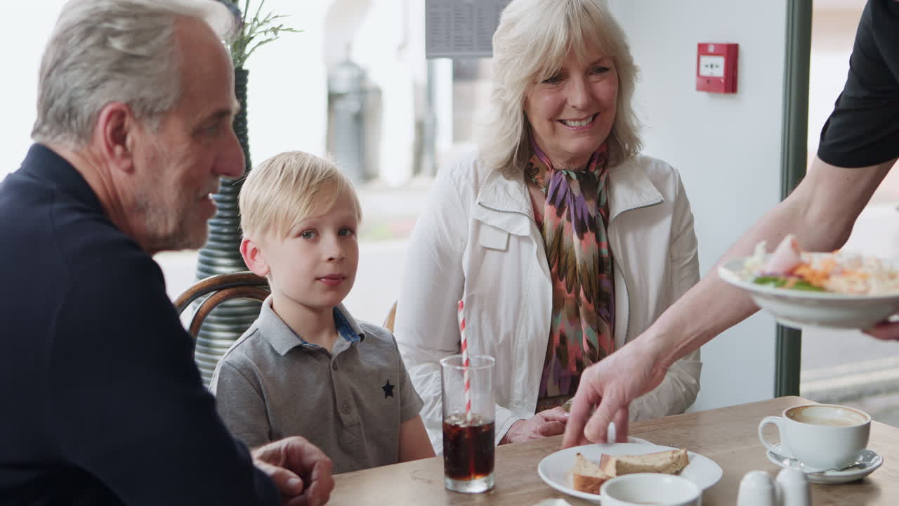 Family enjoying a meal at a cafe