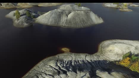 aerial view of an abandoned quarry with water filled pits