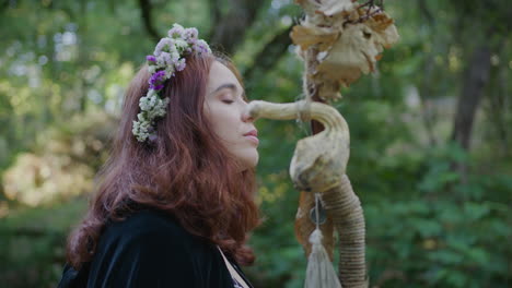 young-druid-girl-in-a-forest-contemplating-the-view-close-shot