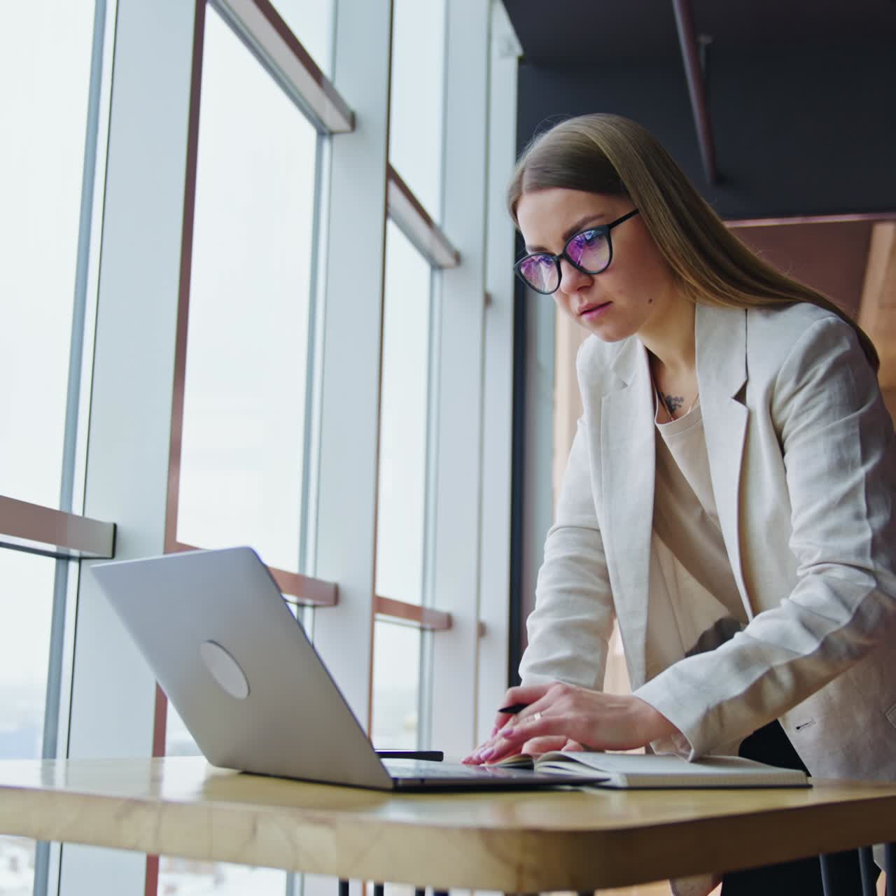 Busy pretty lady in modern office. Professional business office communication