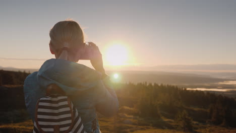 An-Active-Woman-Is-Taking-Pictures-Of-A-Beautiful-Landscape-With-A-Retro-Camera-Standing-On-The-Top-