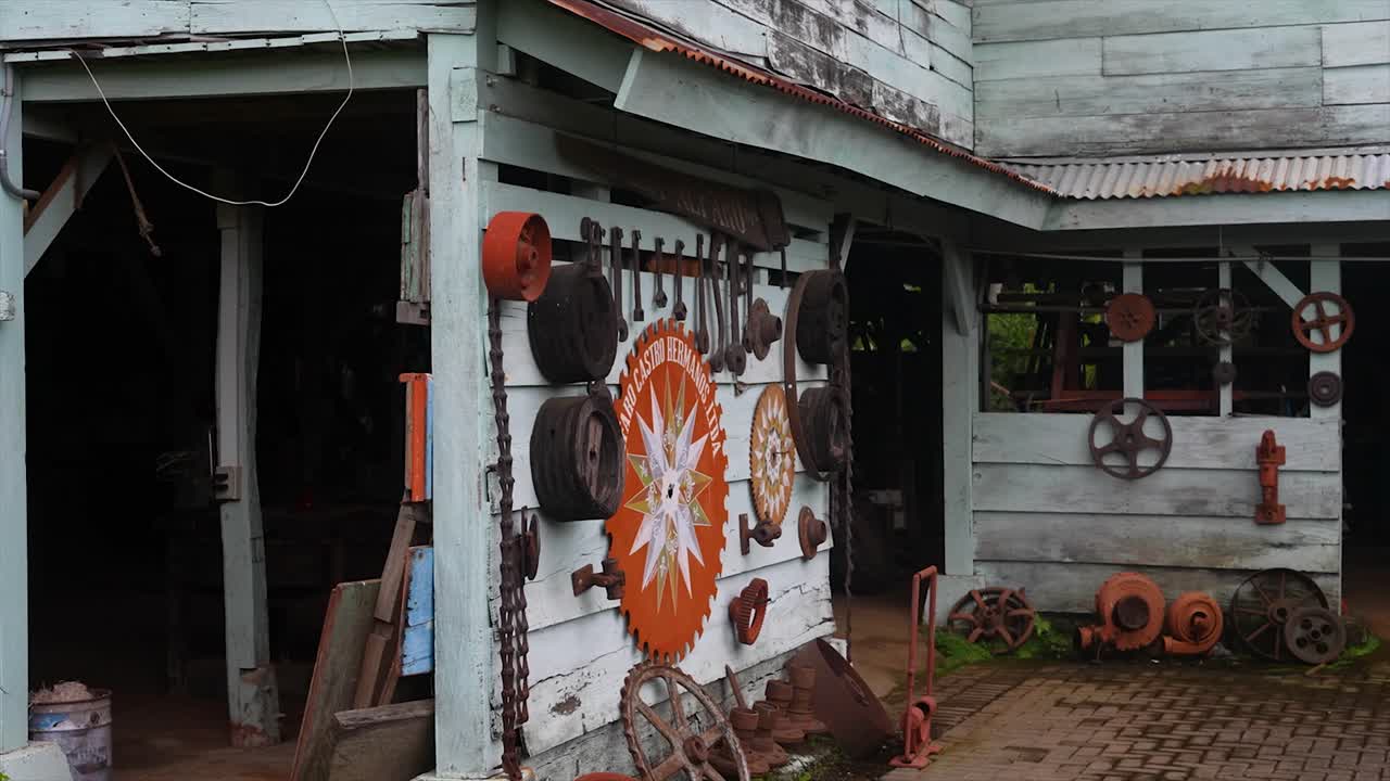 Rustic outdoor display of antique industrial machinery and tools