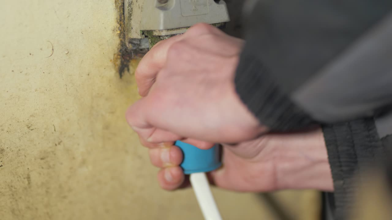 Plugging in three-phase plug outdoor