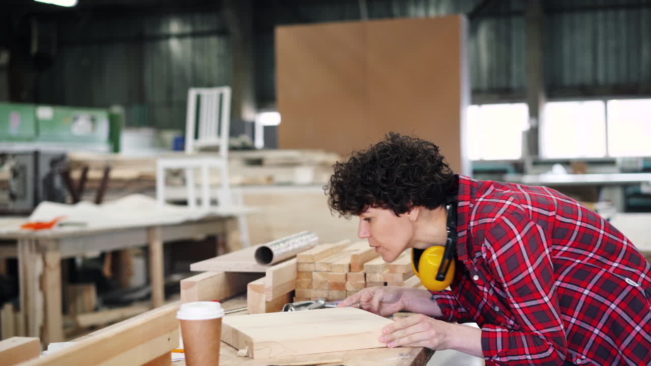Woman Woodworker Sanding Wood