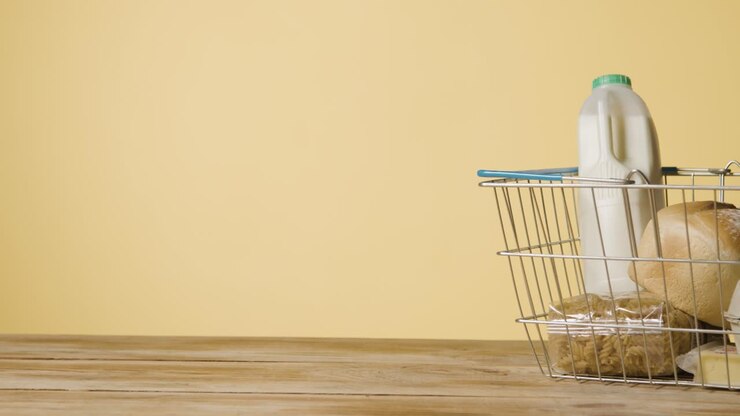 Studio Shot Of Basic Food Items In Supermarket Wire Shopping Basket 5