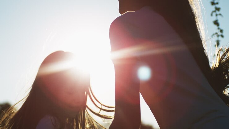 Mother and Daughter Enjoying a Sunset
