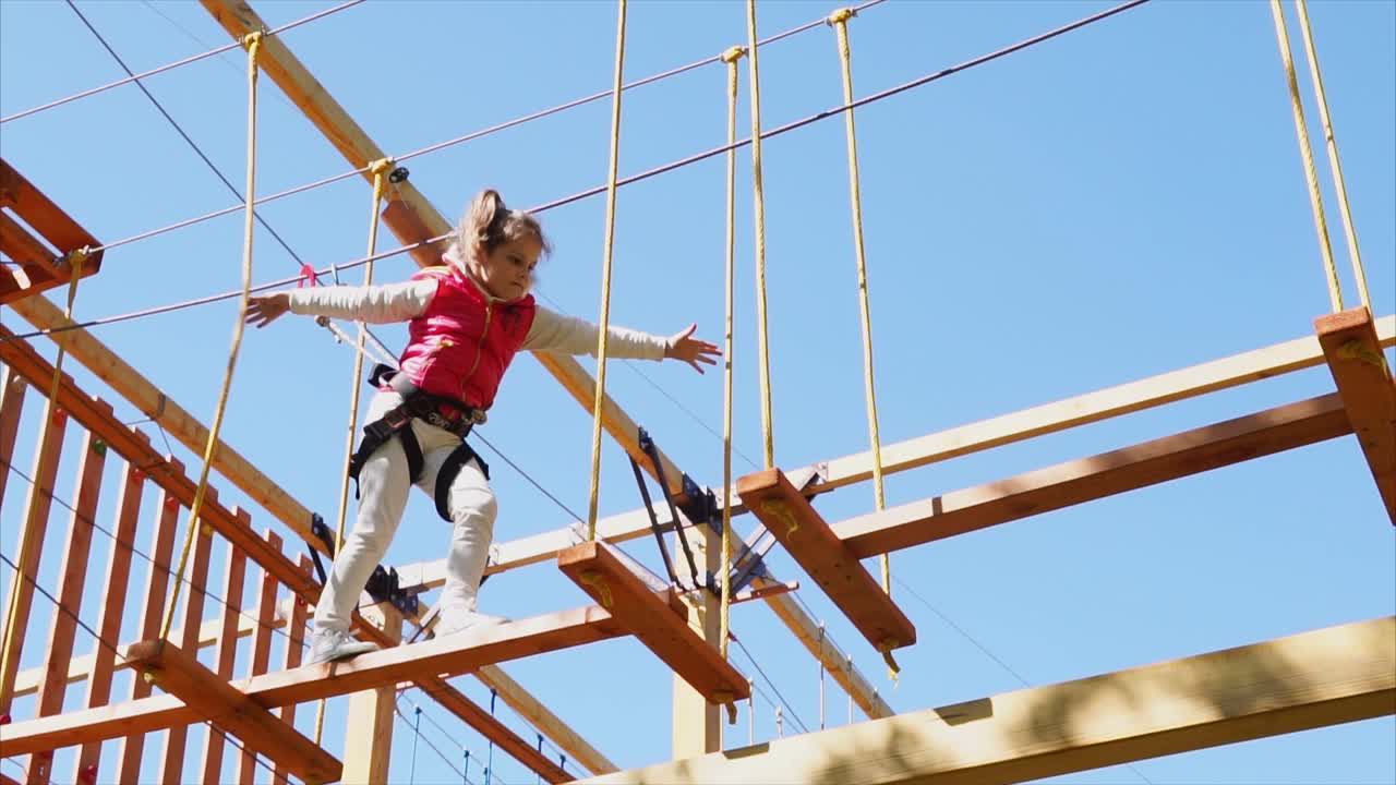 Child on a Treetop Adventure Course