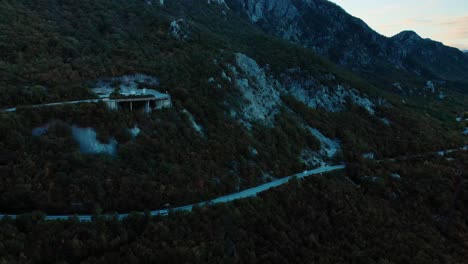 aerial medium shot of mountain road after sunset-10