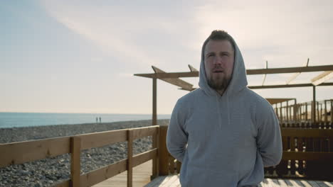 man stretching at the beach