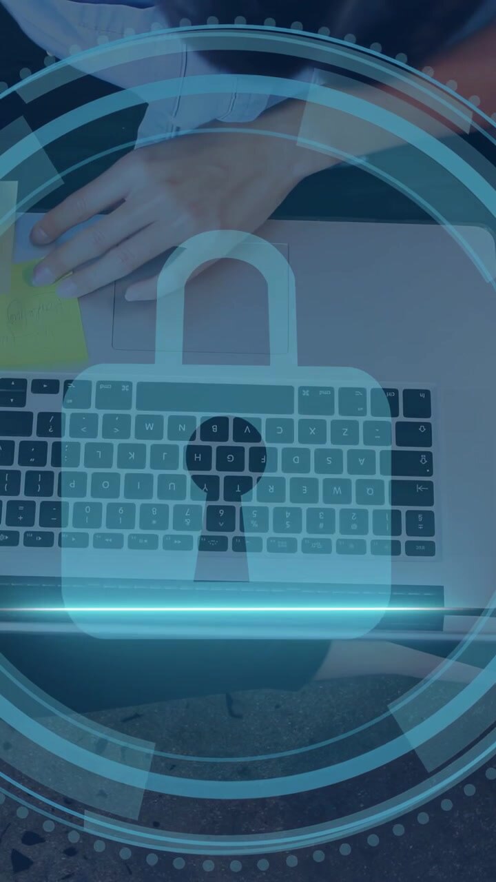 Vertical video: Woman reaching sticky note, typing causing padlock HUD centering keys for security