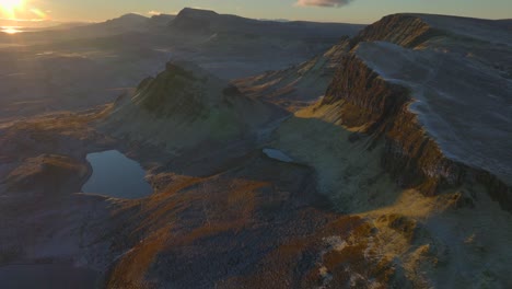 Giant-ancient-landslip-mountain-scenery-at-dawn-in-winter-with-small-Lochs