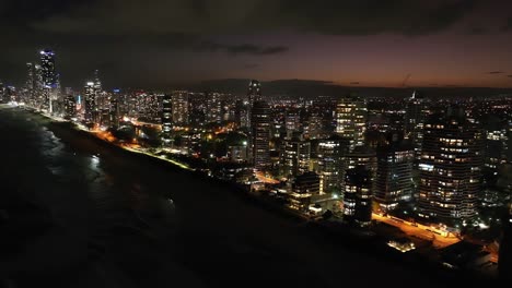 beautiful colours, drone view gold coast beachfront at early eveing, surfers paradise ablaze with amazing shimmering light