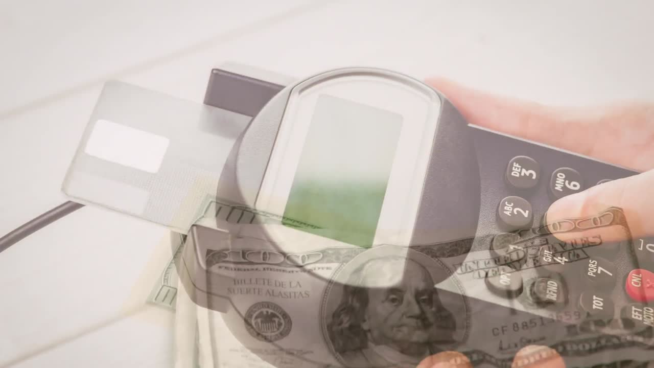 Animation of dollar banknotes falling over hand of caucasian man holding payment terminal