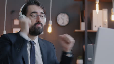 businessman celebrating during video call