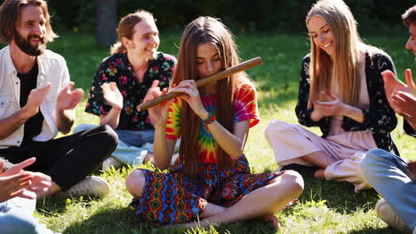 friends enjoying music in a park