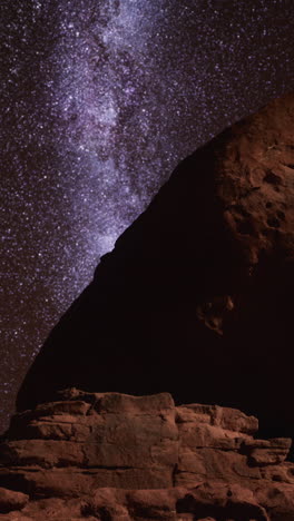 milky way over a red rock formation