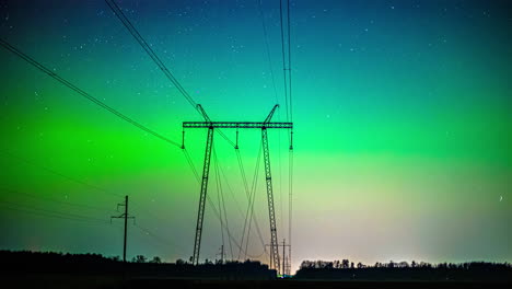 timelapse of a geomagnetic aurora storm behind a electric pylon on the countryside