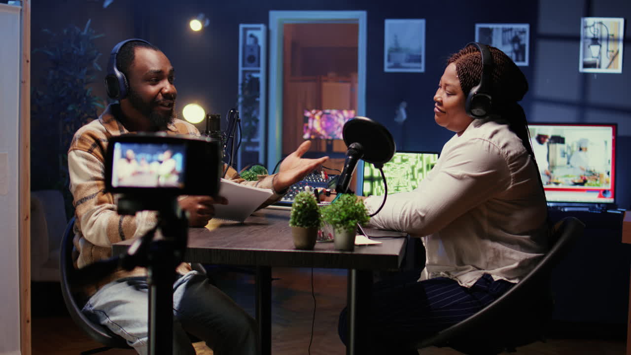 Content creators doing podcasting session with filming gear