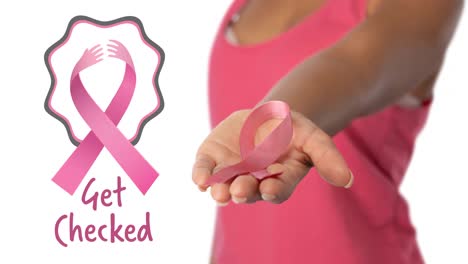 Animation-of-get-checked-text-with-ribbon-logo-over-midsection-of-woman-holding-pink-cancer-ribbon